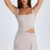 Acadia Belted Cut-Out Mini Dress in Taupe Acadia Belted Cut-Out Mini Dress in Taupe