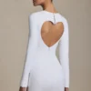 Adelia Cut-Out Heart-Detail Bodycon Mini Dress in White Adelia Cut-Out Heart-Detail Bodycon Mini Dress in White