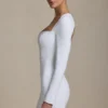 Adelia Cut-Out Heart-Detail Bodycon Mini Dress in White Adelia Cut-Out Heart-Detail Bodycon Mini Dress in White
