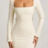 Akari Pearl-Detail Cut-Out Mini Dress in Ivory Akari Pearl-Detail Cut-Out Mini Dress in Ivory