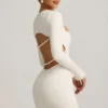 Akari Pearl-Detail Cut-Out Mini Dress in Ivory Akari Pearl-Detail Cut-Out Mini Dress in Ivory