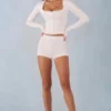 Amoura Knit Mid-Rise Mini Shorts in Ivory Amoura Knit Mid-Rise Mini Shorts in Ivory