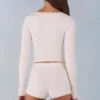 Amoura Knit Mid-Rise Mini Shorts in Ivory Amoura Knit Mid-Rise Mini Shorts in Ivory