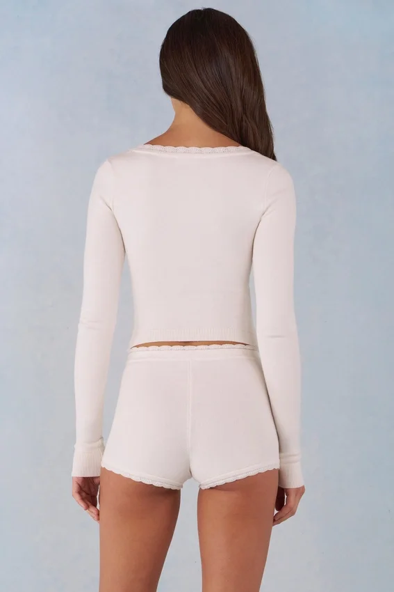 Amoura Knit Mid-Rise Mini Shorts in Ivory Amoura Knit Mid-Rise Mini Shorts in Ivory