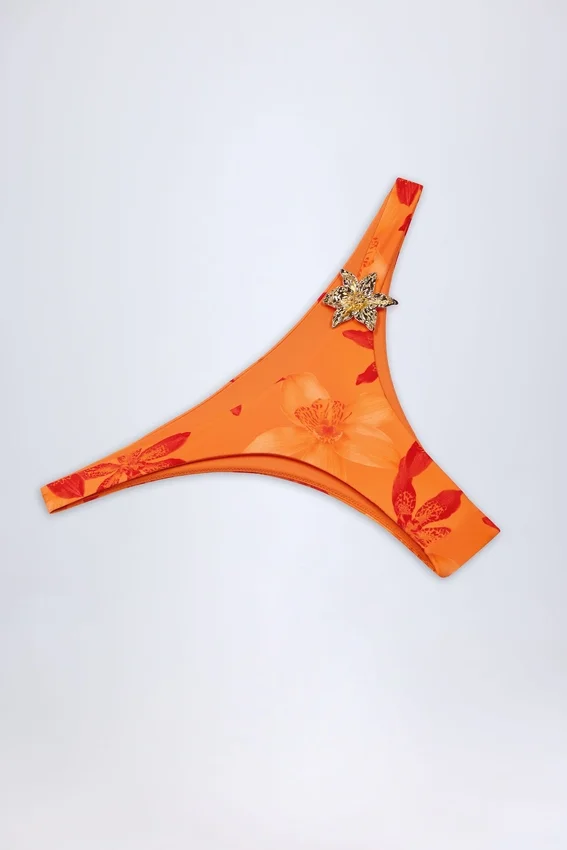 Beqa Hardware-Detail Cheeky Bikini Bottoms in Orange Orchid Print Beqa Hardware-Detail Cheeky Bikini Bottoms in Orange Orchid Print