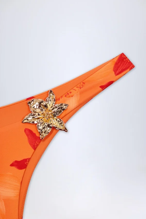 Beqa Hardware-Detail Cheeky Bikini Bottoms in Orange Orchid Print Beqa Hardware-Detail Cheeky Bikini Bottoms in Orange Orchid Print