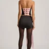 Carola Satin Bow-Detail Low-Rise Mini Skirt in Black Carola Satin Bow-Detail Low-Rise Mini Skirt in Black