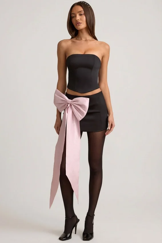 Carola Satin Bow-Detail Low-Rise Mini Skirt in Black Carola Satin Bow-Detail Low-Rise Mini Skirt in Black