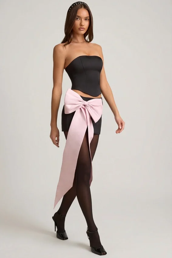 Carola Satin Bow-Detail Low-Rise Mini Skirt in Black Carola Satin Bow-Detail Low-Rise Mini Skirt in Black