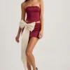 Carola Satin Bow-Detail Low-Rise Mini Skirt in Wine Red Carola Satin Bow-Detail Low-Rise Mini Skirt in Wine Red