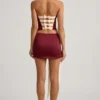 Carola Satin Bow-Detail Low-Rise Mini Skirt in Wine Red Carola Satin Bow-Detail Low-Rise Mini Skirt in Wine Red