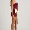 Carola Satin Bow-Detail Low-Rise Mini Skirt in Wine Red Carola Satin Bow-Detail Low-Rise Mini Skirt in Wine Red