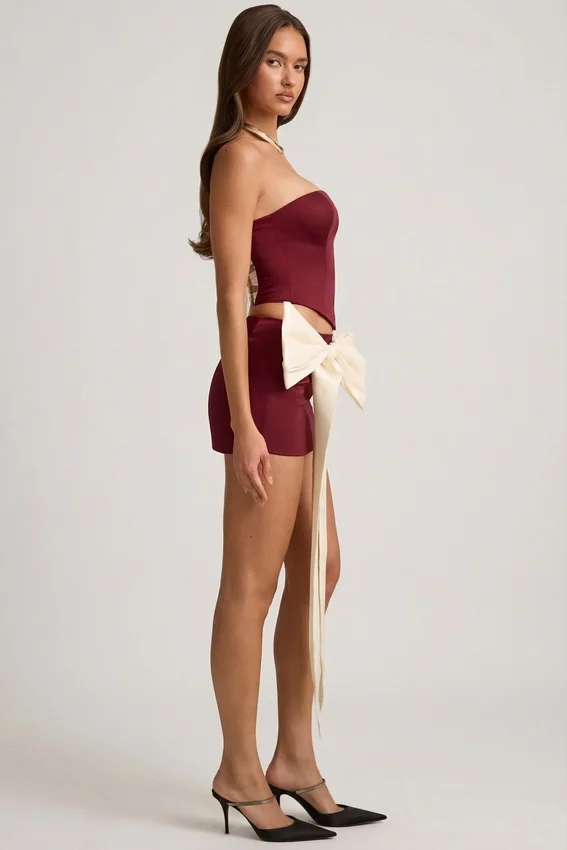 Carola Satin Bow-Detail Low-Rise Mini Skirt in Wine Red Carola Satin Bow-Detail Low-Rise Mini Skirt in Wine Red