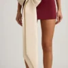 Carola Satin Bow-Detail Low-Rise Mini Skirt in Wine Red Carola Satin Bow-Detail Low-Rise Mini Skirt in Wine Red