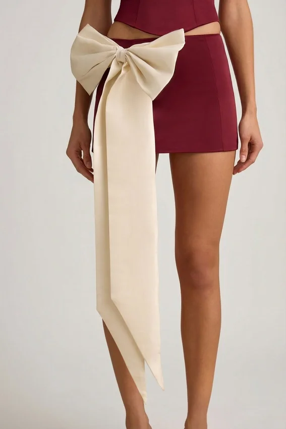 Carola Satin Bow-Detail Low-Rise Mini Skirt in Wine Red Carola Satin Bow-Detail Low-Rise Mini Skirt in Wine Red