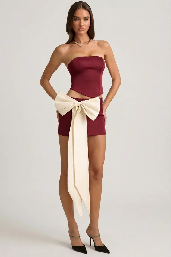 Carola Satin Bow-Detail Low-Rise Mini Skirt in Wine Red Carola Satin Bow-Detail Low-Rise Mini Skirt in Wine Red