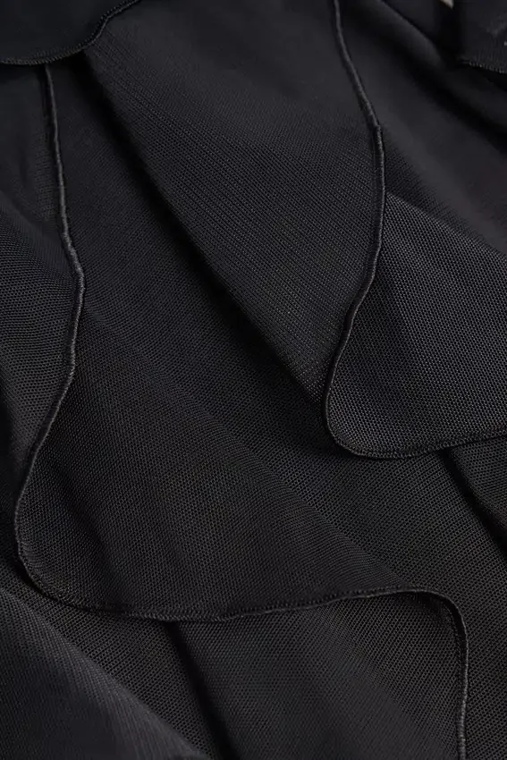 Felicity Ruffled Mid-Rise Flared Trousers in Black Felicity Ruffled Mid-Rise Flared Trousers in Black