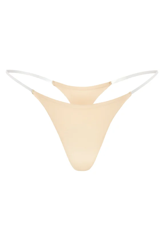 Intimates Seamless Knit Clear Strap Thong in Warm Peach Intimates Seamless Knit Clear Strap Thong in Warm Peach