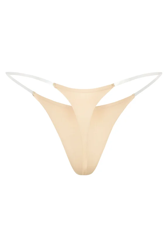 Intimates Seamless Knit Clear Strap Thong in Warm Peach Intimates Seamless Knit Clear Strap Thong in Warm Peach