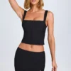 Issa Curved Low-Rise Mini Skirt in Black Issa Curved Low-Rise Mini Skirt in Black