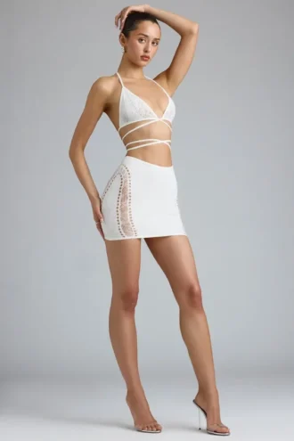 Joni Embellished Mid-Rise Mini Skirt in Ivory Joni Embellished Mid-Rise Mini Skirt in Ivory