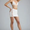 Joni Embellished Mid-Rise Mini Skirt in Ivory Joni Embellished Mid-Rise Mini Skirt in Ivory