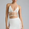 Joni Embellished Mid-Rise Mini Skirt in Ivory Joni Embellished Mid-Rise Mini Skirt in Ivory