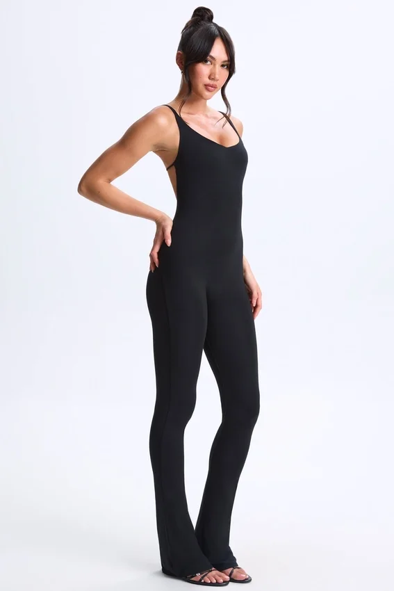 Kiki Modal Plunge Open-Back Flared Jumpsuit in Black Kiki Modal Plunge Open-Back Flared Jumpsuit in Black