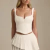 Nada Layered Pleated Low-Rise Mini Skirt in Ivory