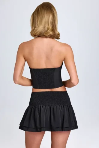 Nellary Ruffled Shirred Low-Rise Micro Mini Skirt in Black
