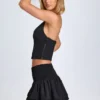 Nellary Ruffled Shirred Low-Rise Micro Mini Skirt in Black