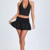 Nellary Ruffled Shirred Low-Rise Micro Mini Skirt in Black