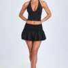 Nellary Ruffled Shirred Low-Rise Micro Mini Skirt in Black