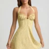 Nerine Halterneck A-Line Mini Dress in Yellow Flower Print Nerine Halterneck A-Line Mini Dress in Yellow Flower Print