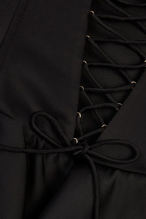 Priaska Ruffled Lace-Up Corset Playsuit in Black Priaska Ruffled Lace-Up Corset Playsuit in Black