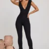 Romana Plunge Neck Ruched Waist Jumpsuit in Black Romana Plunge Neck Ruched Waist Jumpsuit in Black