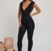 Romana Plunge Neck Ruched Waist Jumpsuit in Black Romana Plunge Neck Ruched Waist Jumpsuit in Black