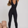 Romana Plunge Neck Ruched Waist Jumpsuit in Black Romana Plunge Neck Ruched Waist Jumpsuit in Black