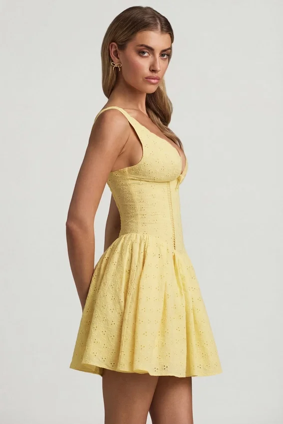 Sabina Broderie Anglaise Bow-Detail A-Line Mini Dress in Pastel Yellow Sabina Broderie Anglaise Bow-Detail A-Line Mini Dress in Pastel Yellow