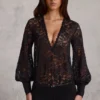 Serenya Sheer Lace Plunge-Neck Loose-Fit Playsuit in Black Serenya Sheer Lace Plunge-Neck Loose-Fit Playsuit in Black