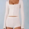 Amoura Knit Mid-Rise Mini Shorts in Ivory Amoura Knit Mid-Rise Mini Shorts in Ivory