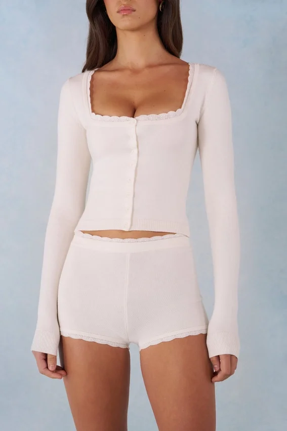 Amoura Knit Mid-Rise Mini Shorts in Ivory Amoura Knit Mid-Rise Mini Shorts in Ivory