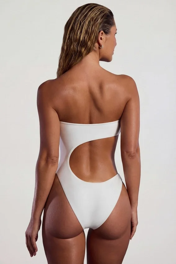 Tulum Bead-Embellished Cut-Out Bandeau Swimsuit in Ivory Tulum Bead-Embellished Cut-Out Bandeau Swimsuit in Ivory