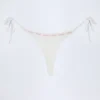 Vernazza Broderie Anglaise Side-Tie Thong Bikini Bottoms in White Vernazza Broderie Anglaise Side-Tie Thong Bikini Bottoms in White
