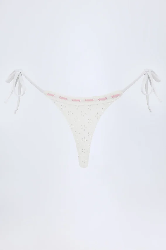 Vernazza Broderie Anglaise Side-Tie Thong Bikini Bottoms in White Vernazza Broderie Anglaise Side-Tie Thong Bikini Bottoms in White