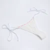 Vernazza Broderie Anglaise Side-Tie Thong Bikini Bottoms in White Vernazza Broderie Anglaise Side-Tie Thong Bikini Bottoms in White