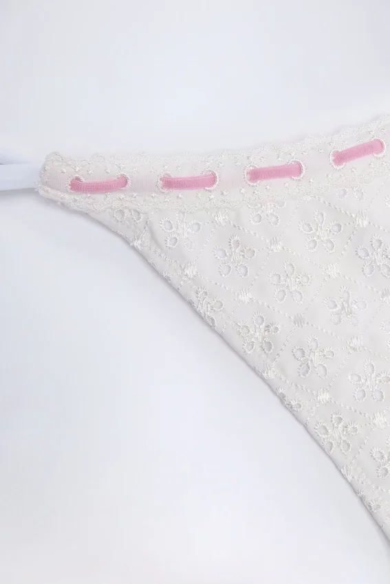 Vernazza Broderie Anglaise Side-Tie Thong Bikini Bottoms in White Vernazza Broderie Anglaise Side-Tie Thong Bikini Bottoms in White
