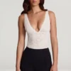 Zayla Sheer Lace Scalloped Plunge-Neck Bodysuit in White Zayla Sheer Lace Scalloped Plunge-Neck Bodysuit in White
