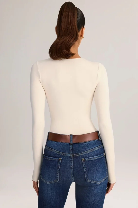 Ziva Modal Round-Neck Long-Sleeve Bodysuit in Cream Ziva Modal Round-Neck Long-Sleeve Bodysuit in Cream