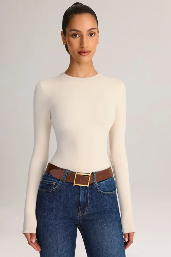 Ziva Modal Round-Neck Long-Sleeve Bodysuit in Cream Ziva Modal Round-Neck Long-Sleeve Bodysuit in Cream